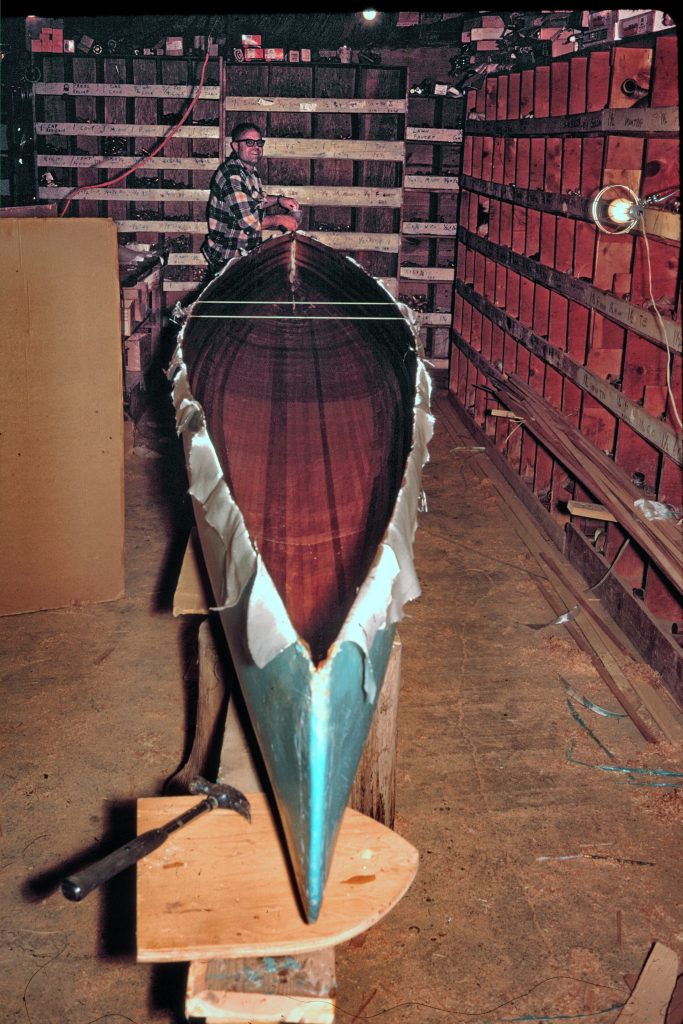 Verlen Kruger building a wood strip canoe. 1969
